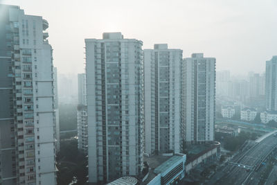 High angle view of buildings in city against sky