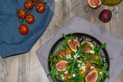 High angle view of fruits in plate on table