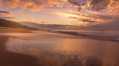 Scenic view of sea against sky during sunrise