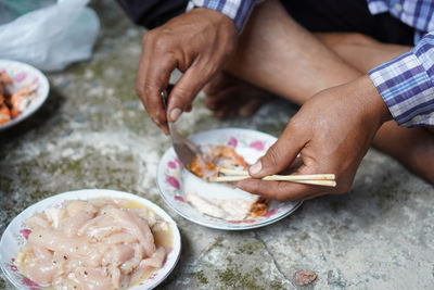 High angle view of man preparing food on table