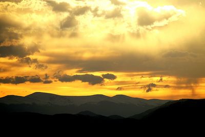 Scenic view of mountains at sunset