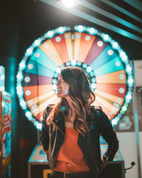 Woman standing in amusement park ride