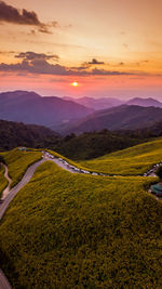 Scenic view of landscape against sky during sunset