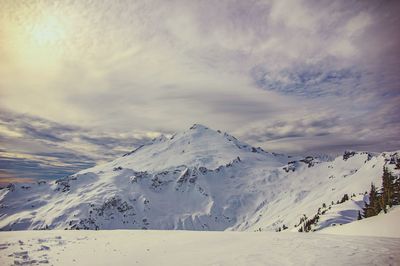 Scenic view of snowcapped mountains against sky