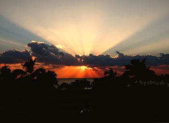 Scenic view of silhouette landscape against sky at sunset