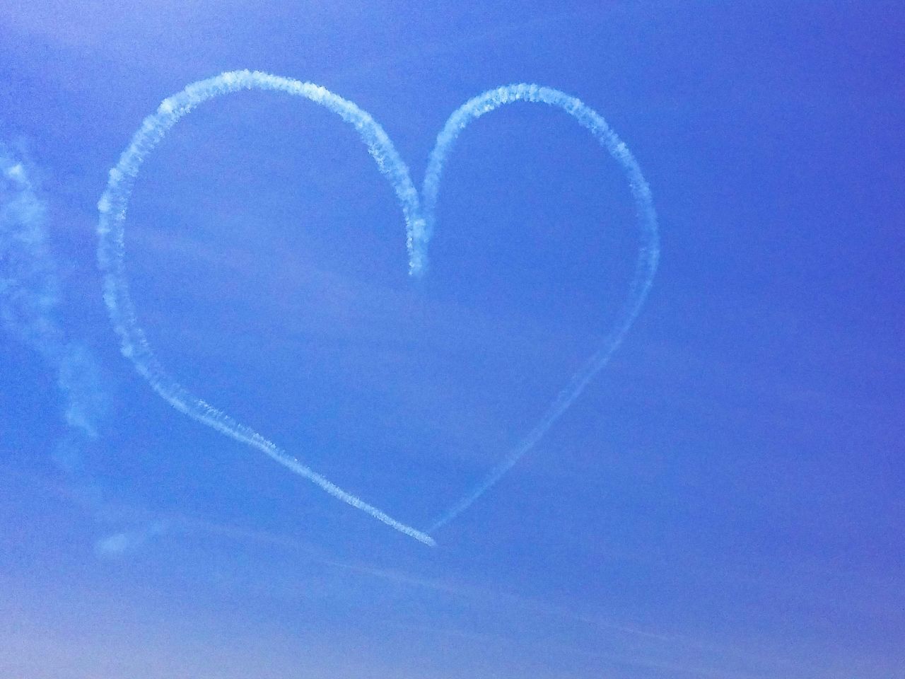LOW ANGLE VIEW OF HEART SHAPE AGAINST SKY