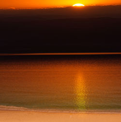 Scenic view of sunset over lake