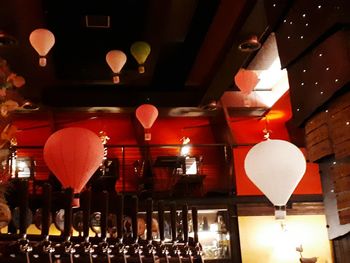 Illuminated lanterns hanging at night