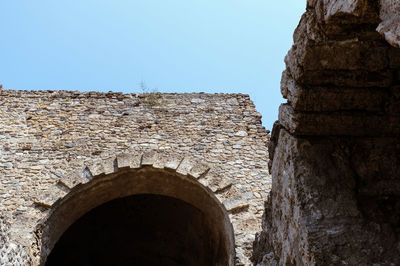 Low angle view of old building against clear sky