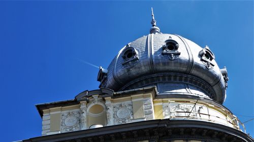 Low angle view of building against blue sky