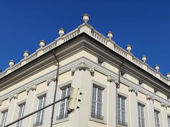 Low angle view of building against blue sky