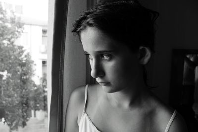 Close-up of young woman looking away