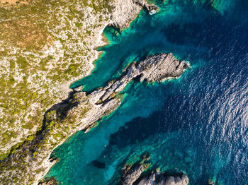 High angle view of rocks on shore