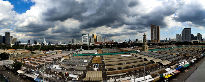 High angle view of buildings in city against sky