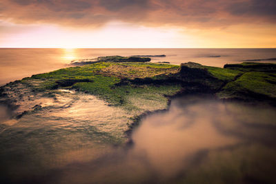 Scenic view of sea against sky during sunset