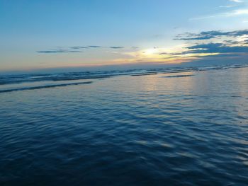 Scenic view of sea against sky at sunset