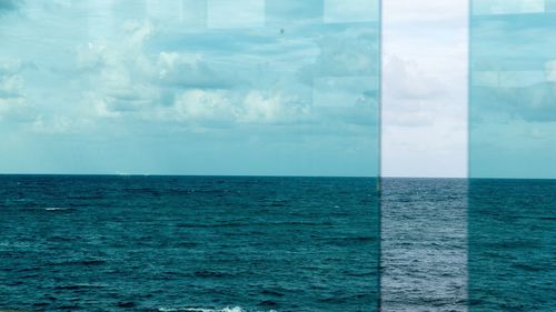 Scenic view of sea against blue sky