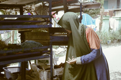 Side view of man working at construction site