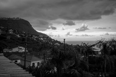 Panoramic view of buildings and sea against sky