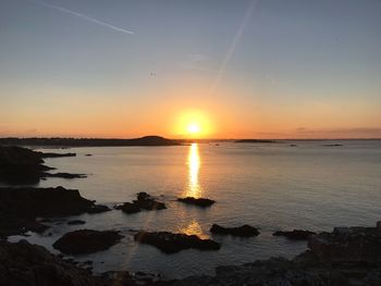 Scenic view of sea against sky at sunset