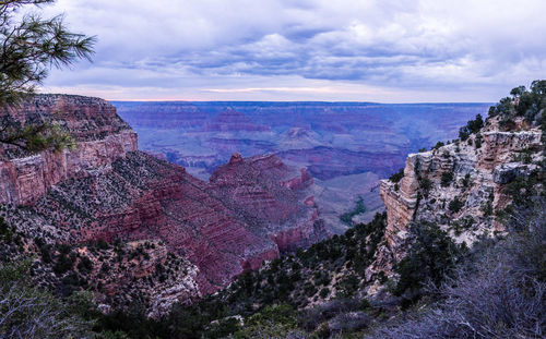 Scenic view of rocky mountains against cloudy sky at grand canyon national park