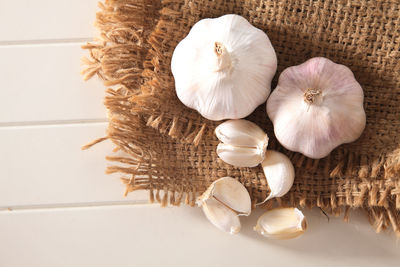 Close-up of garlic on burlap