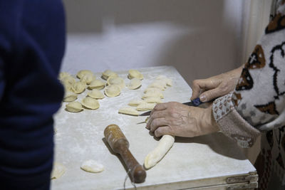 Midsection of man preparing food