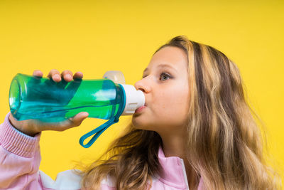 Young woman drinking water