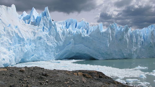 Panoramic view of frozen sea against sky