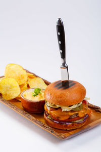 Close-up of cake on plate against white background