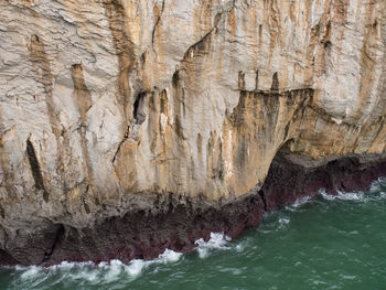 Scenic view of rock formation in sea