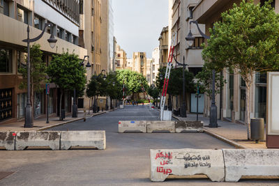 Road by buildings in city