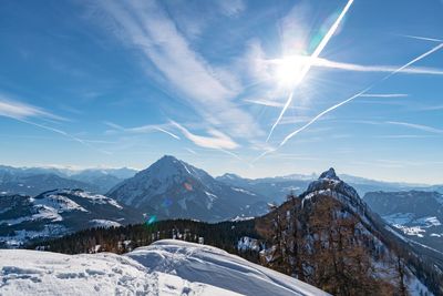 Scenic view of snowcapped mountains against sky