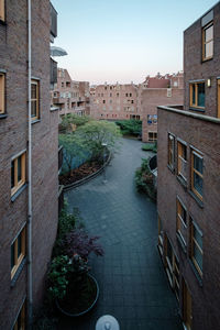 Exterior of buildings in town against sky