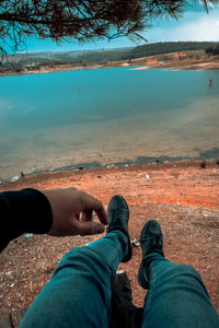 Low section of man relaxing on land