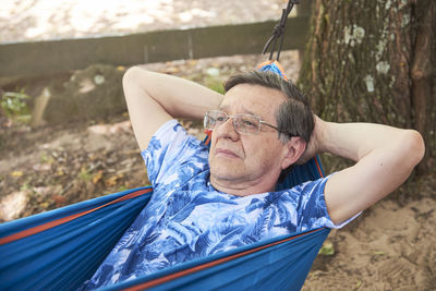 Low angle view of man with umbrella