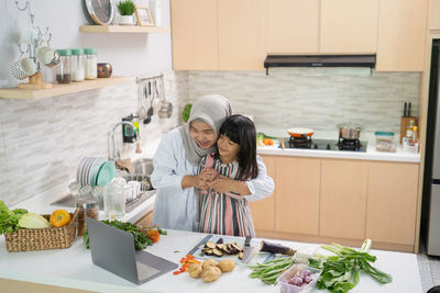 Woman with vegetables at home