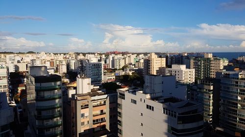 High angle view of buildings in city against sky