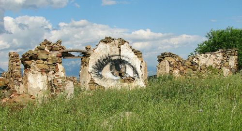 Built structure against cloudy sky