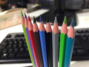 Close-up of multi colored pencils on table