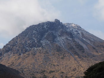 Rock formations on mountain against sky