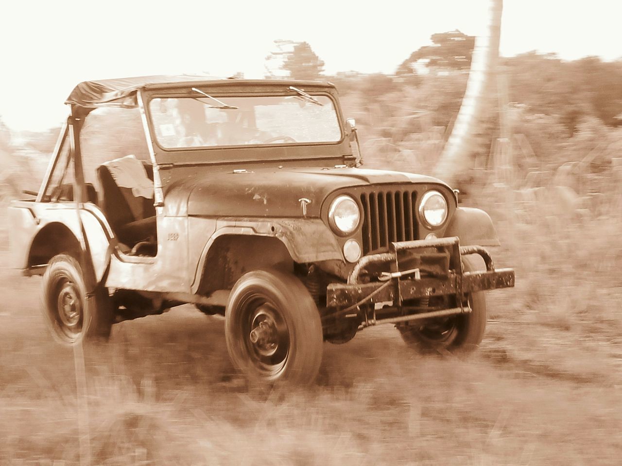 VINTAGE CAR PARKED ON ROAD