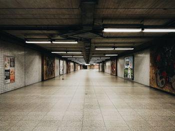 Empty illuminated subway tunnel