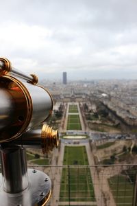 Coin-operated binoculars on eiffel tower overlooking city