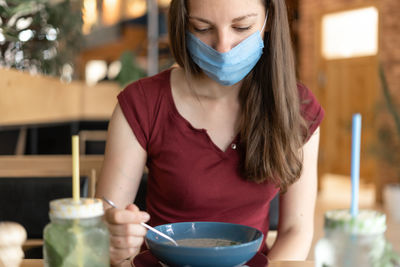 Woman looking at food during pandemic