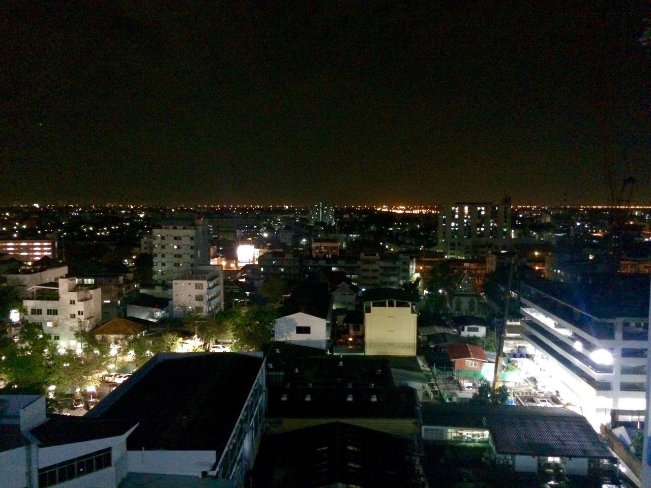 cityscape, city, building exterior, architecture, illuminated, built structure, night, crowded, high angle view, residential district, residential building, residential structure, city life, sky, no people, clear sky, outdoors, copy space, skyscraper, dark