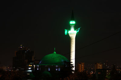 Illuminated buildings in city at night