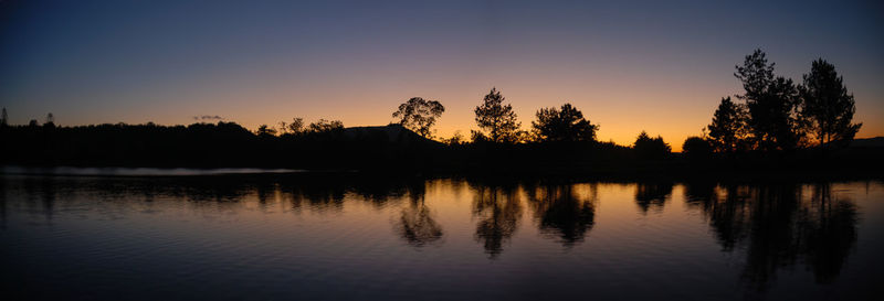 Scenic view of lake at sunset