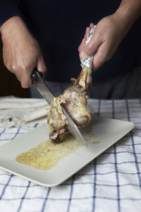 Close-up of person preparing food on table