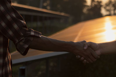 Midsection of man holding hands